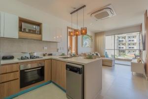 a kitchen with a sink and a stove top oven at BaiaKristal-Kabo3-3A in Cartagena de Indias