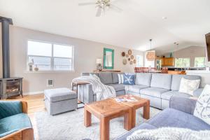 a living room with a couch and a table at True North in Rockaway Beach