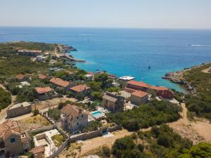 an aerial view of a house and the ocean at Villa Rustica - Veslo in Begovići