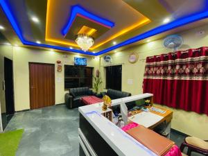 a living room with a couch and a table at Hotel Vindhwasni Palace in Sītāmarhi