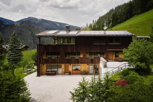a house in the middle of a mountain at Chalet Vanzi in San Martino in Badia