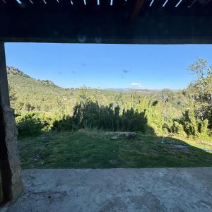 a view from the porch of a house with a view at Selene Malen 5 in Villa Pehuenia +9 photos