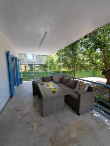 a living room with a couch and a table at Zoya's house in Nea Kallikrateia
