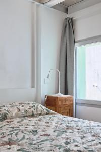 a bedroom with a bed and a window at Sottomarina Suite Palazzo Storico in Chioggia