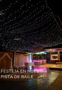 a room with a ceiling with stars on it at Hotel Cristian in Puyo +23 photos