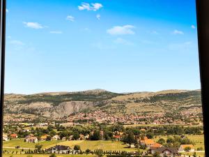 a view of a town with mountains in the background at Apartman Dream in Livno