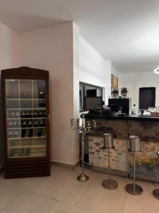 a room with a counter and a glass door at Hotel Zurich in Golem
