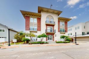 a large brick building on a street at Bentonvilla in Bentonville