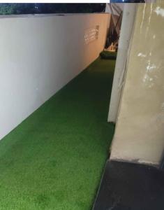 a room with green flooring in a building at Oran Choupot boulevard principale in Oran