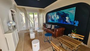 a living room with a large flat screen tv on a wall at Suite atlántica in Oya