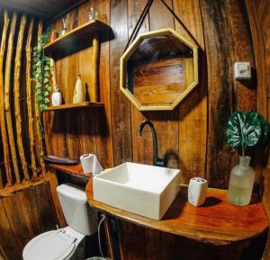 a bathroom with a sink and a toilet at CHALÉ ANGELIM in Belém