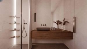 a bathroom with a sink on a wooden counter at Lisavet Skala Kefalonia - Emerald Home Beachfront in Valsamáta