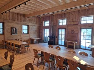 a large room with tables and chairs and windows at Hotel Spechtshaardt in Rothenbuch +70 photos