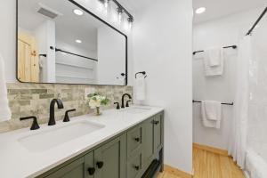 a bathroom with a sink and a mirror at Custer Love Shack in Custer +67 photos
