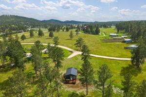 an aerial view of a farm with a barn and a road at Custer Love Shack in Custer