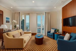 a living room with couches and a flat screen tv at Regent Porto Montenegro in Tivat
