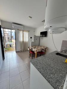 a kitchen and a dining room with a table at Condominio Diamante in San Rafael