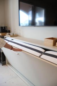 a bed frame in a room with a mirror at Lumiére Marine in Roseto degli Abruzzi