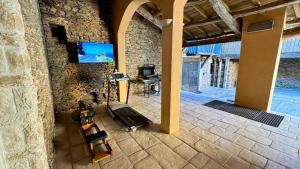 an overhead view of a living room with a tv on a stone wall at Les Vieilles Planches in Pampelonne