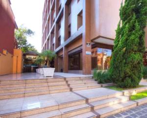 a building with stairs in front of a building at Flat no centro de Curitiba in Curitiba
