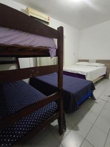 a room with two bunk beds in a room at Pousada Bom Jesuss in Juazeiro do Norte