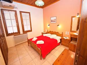 Postel nebo postele na pokoji v ubytování Villa Aglaini