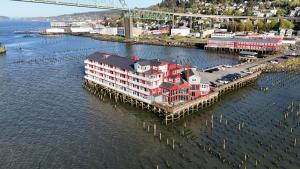 an aerial view of a building on a dock in the water at Cannery Pier Hotel & Spa in Astoria, Oregon