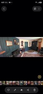 a view of a living room with a picture of a house at JOSIAH KEITH HOUSE museum & inn in Five Corners