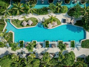 an aerial view of a resort swimming pool at Pullman Khao Lak Resort in Khao Lak