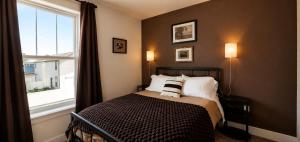 a bedroom with a bed and a window at Walkable to Parks, Yellowstone River, Coffee Shop in Billings