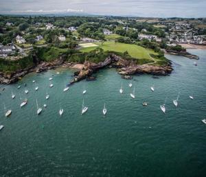 an aerial view of a bunch of boats in the water at Dunmore East Studio in Rathmoylan +1 photo