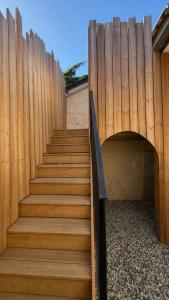 a set of stairs with a wooden fence at COCON Mayennais - Loft Balnéo Laval in Laval