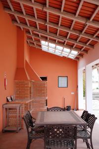 a dining room with a table and chairs at Quinta da Shambhala in Soriço