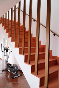 an office with stairs with a treadmill under it at Quinta da Shambhala in Soriço