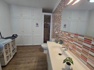 a bathroom with a sink and a toilet in it at Casa Memela 6 in Tías +19 photos