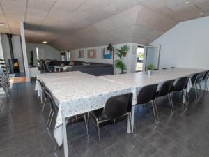 a large table and chairs in a room at Luxury Retreat in Vorupor in Snedsted +47 photos