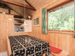 a dining room with a table and a window at 8 person holiday home in Hovborg-By Traum in Hovborg