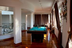 a living room with a pool table in it at Villa Dedinje in Belgrade