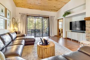 a living room with a couch and a table at Hot Tub, Deck & Grill! Mtn Retreat in Show Low in Show Low