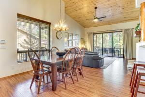 a dining room and living room with a table and chairs at Hot Tub, Deck & Grill! Mtn Retreat in Show Low in Show Low