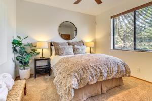 a bedroom with a large bed and a mirror at Hot Tub, Deck & Grill! Mtn Retreat in Show Low in Show Low
