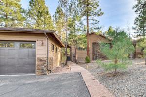 a house with a garage and a driveway at Hot Tub, Deck & Grill! Mtn Retreat in Show Low in Show Low