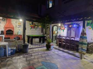 a room with a ping pong table and a pool table at Recanto dos Loureiros in Saquarema