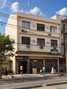 a building with people walking in front of it at The Birthplace of Samba Carioca in Rio de Janeiro