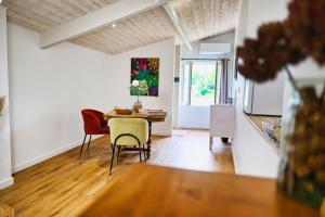 a kitchen and dining room with a table and chairs at Chambre d'hôtes Château Austerlitz in Libourne