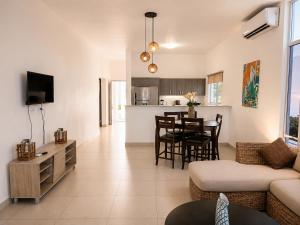 a living room with a couch and a table at Blue Diamond Suite de playa in Playa Blanca