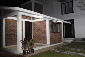 a front porch of a brick house at night at Hotel GUERRERO in Zacatlán