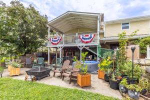 a house with a patio with chairs and plants at Mountain Forest Manor in Hiawassee