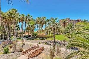 a park with palm trees and a building at Bella Sirena Villa 8 - Your Dream Coastal Escape in Puerto Peñasco