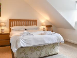a bedroom with a bed with towels on it at Bunker - Uk11039 in Carlyon Bay +3 photos